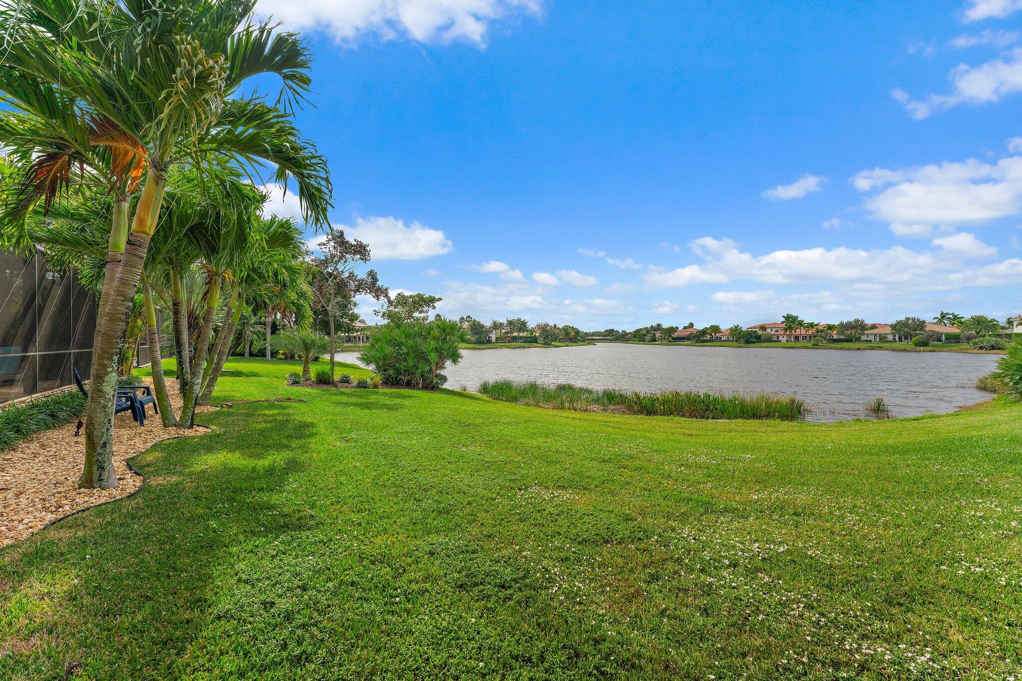 266 Rudder Cay Way Jupiter, FL 33458 - Photo 66 of 79 a view of a lake with houses in the back