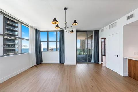 a open kitchen with stainless steel appliances granite countertop a refrigerator and a sink