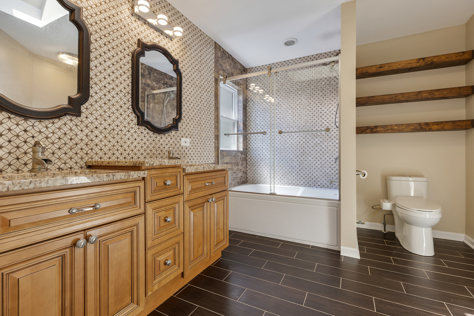 2575 Adamsway Drive Aurora, IL 60502 - Photo 15 of 30 a bathroom with a double vanity sink and a mirror