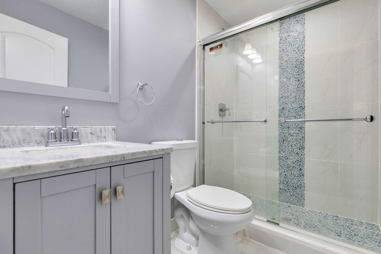 2575 Adamsway Drive Aurora, IL 60502 - Photo 22 of 30 a bathroom with a granite countertop sink toilet and shower