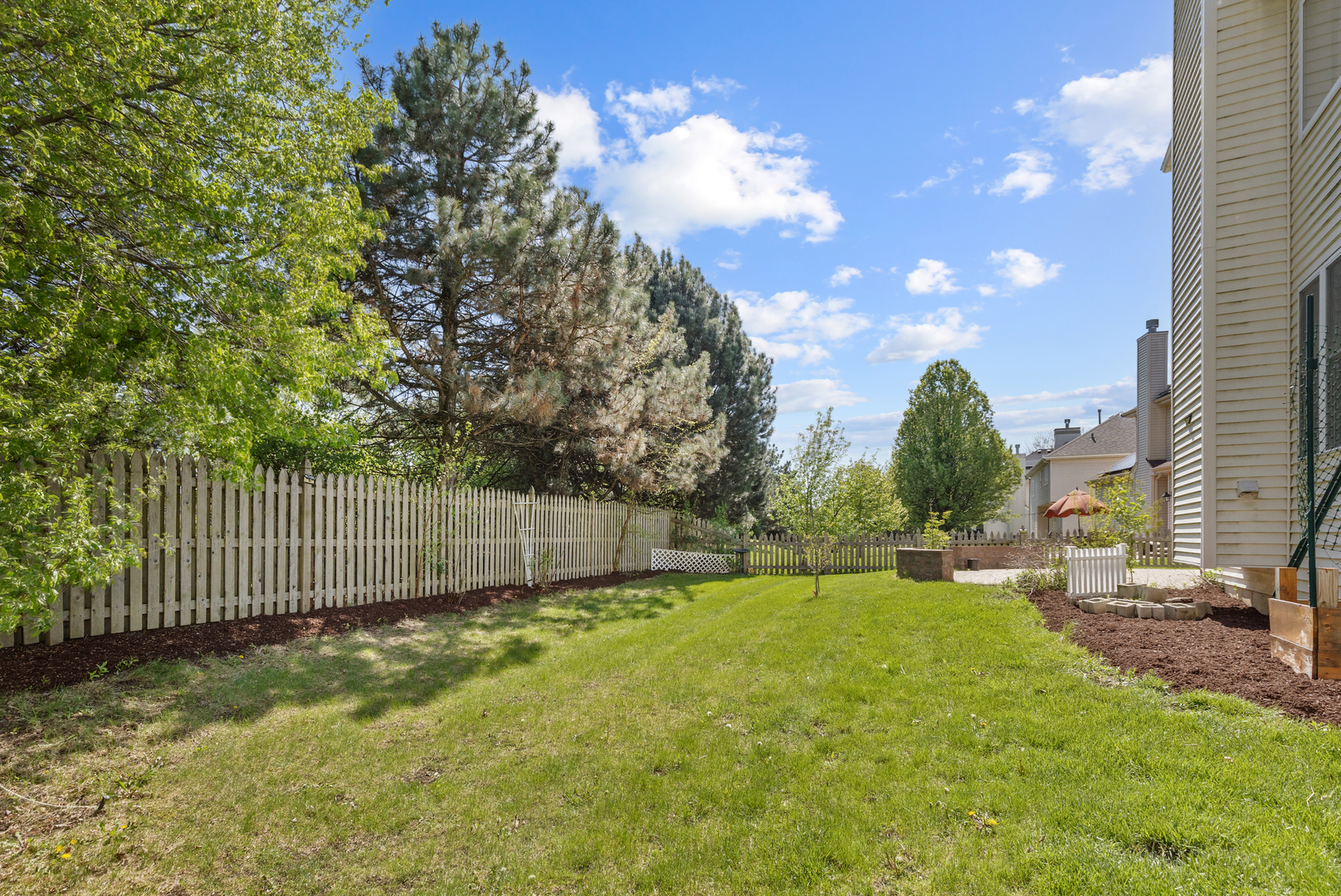 2575 Adamsway Drive Aurora, IL 60502 - Photo 26 of 30 a view of a backyard with a garden
