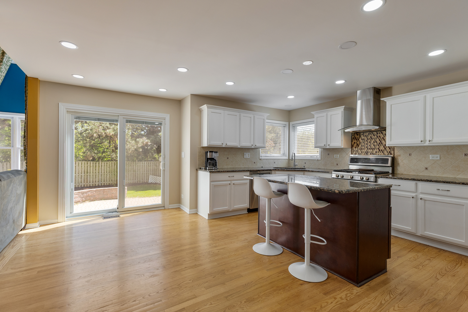 2575 Adamsway Drive Aurora, IL 60502 - Photo 7 of 30 a kitchen with a sink cabinets and wooden floor