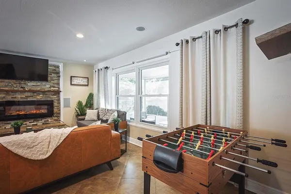 a living room with furniture and a fireplace
