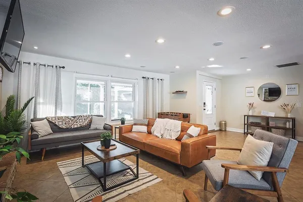 a living room with furniture and a large window