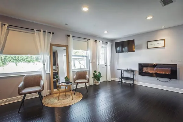 a living room with furniture and a large window