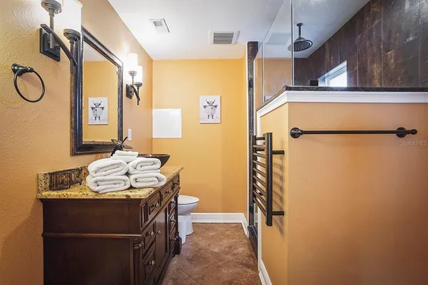 a bathroom with a sink a vanity and a mirror