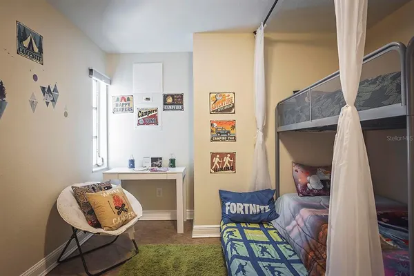 a living room with furniture and a chair
