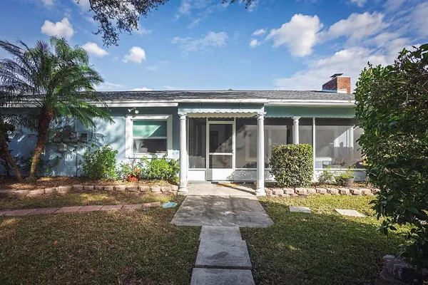 a front view of house with yard and green space