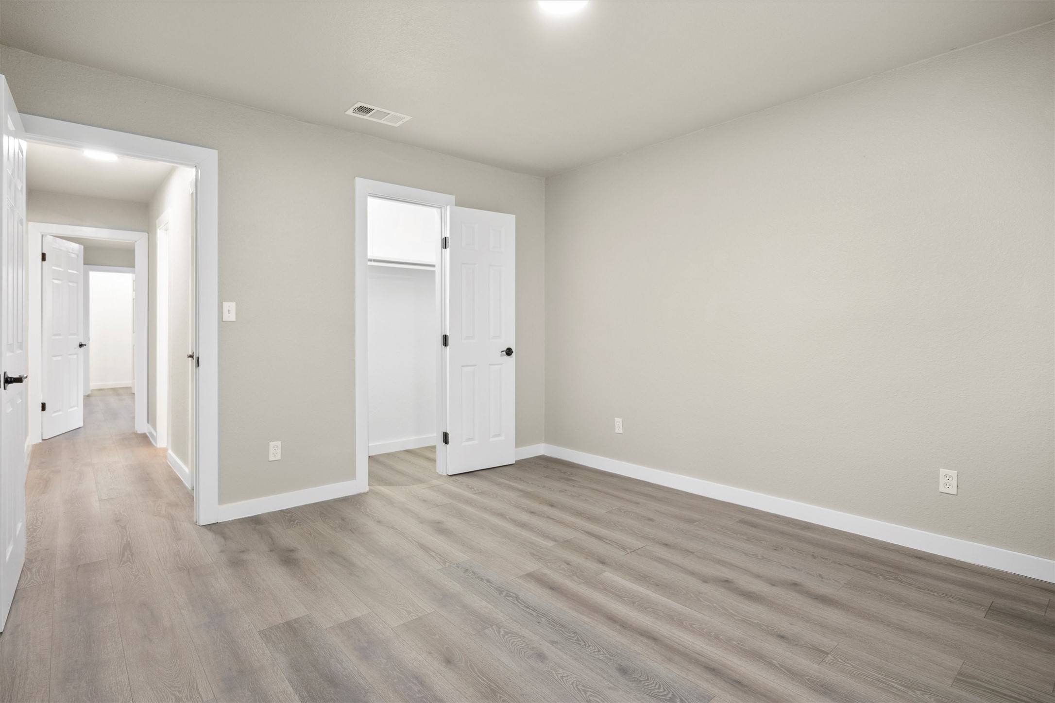 502 Pin Tail Lane Taylor, TX 76574 - Photo 11 of 26 Room featuring light grey walls and wood-finish flooring