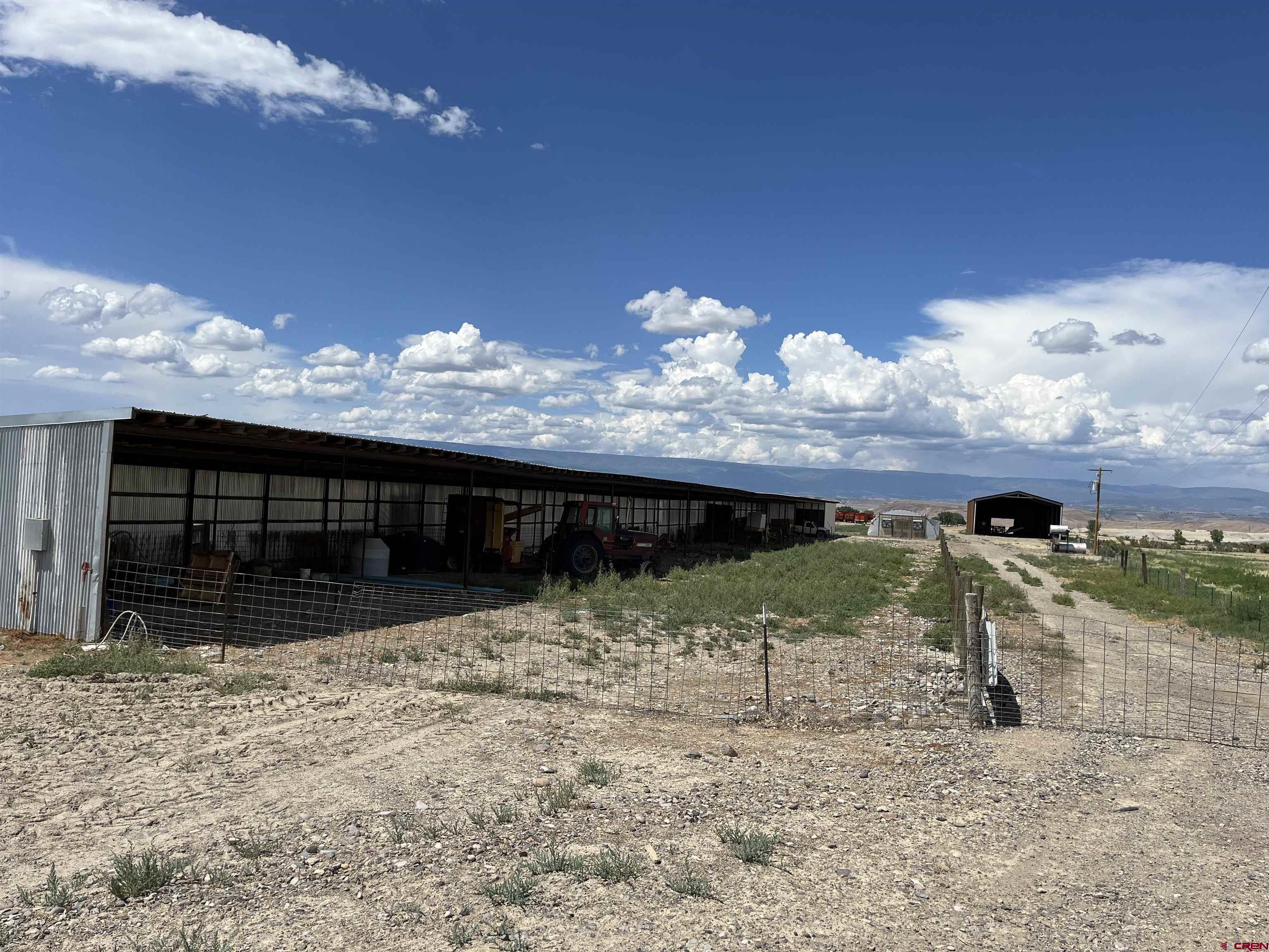 23223 D50 Road Delta, CO 81416 - Photo 14 of 14 a view of a house with a yard