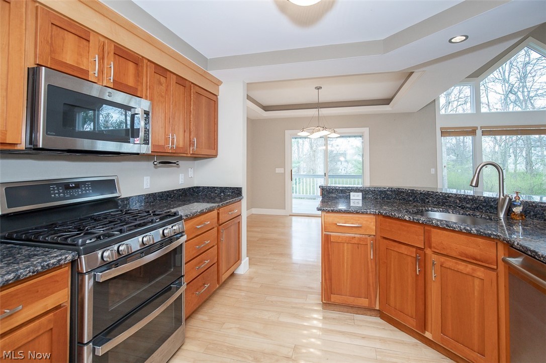 7282 Holzhauer Road Northfield, OH 44067 - Photo 13 of 47 Kitchen with newer stainless appliances