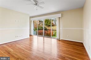 2 Hamlet Hill Road Baltimore, MD 21210 - Photo 12 of 20 wooden floor in an empty room with a window