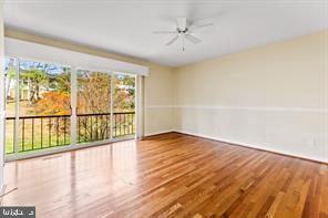2 Hamlet Hill Road Baltimore, MD 21210 - Photo 13 of 20 a view of an empty room with wooden floor and a window