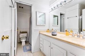 2 Hamlet Hill Road Baltimore, MD 21210 - Photo 14 of 20 a en suite bathroom with a granite countertop sink and a mirror