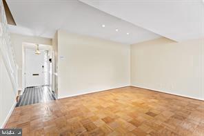 2 Hamlet Hill Road Baltimore, MD 21210 - Photo 9 of 20 an empty room with wooden floor and bathroom
