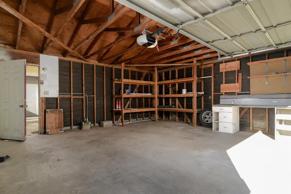 a view of an empty room with furniture