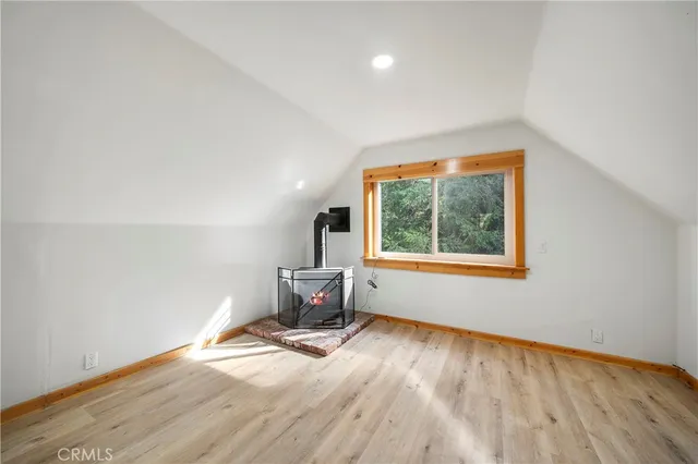 a workspace with wooden floor and window
