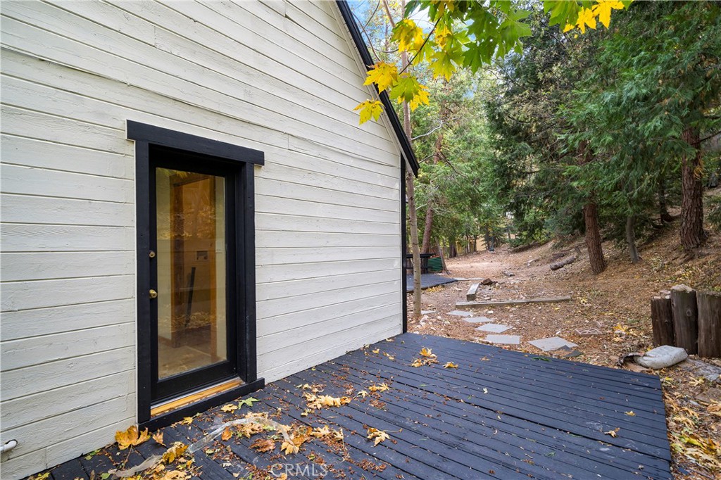 814 Glen View Lane Twin Peaks, CA 92391 - Photo 29 of 38 a view of a house with a wooden door