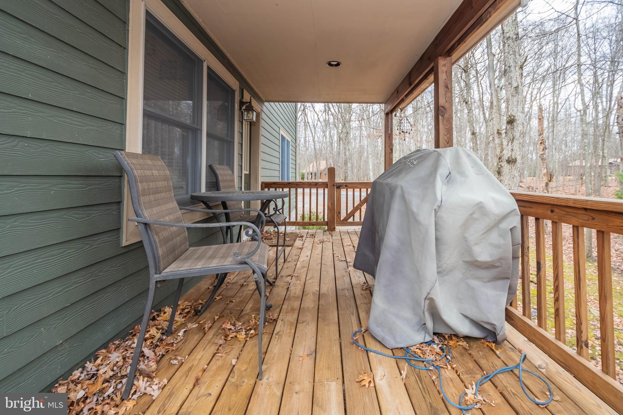 31 Linz Lane Swanton, MD 21561 - Photo 12 of 51 a view of balcony with wooden floor and outdoor seating