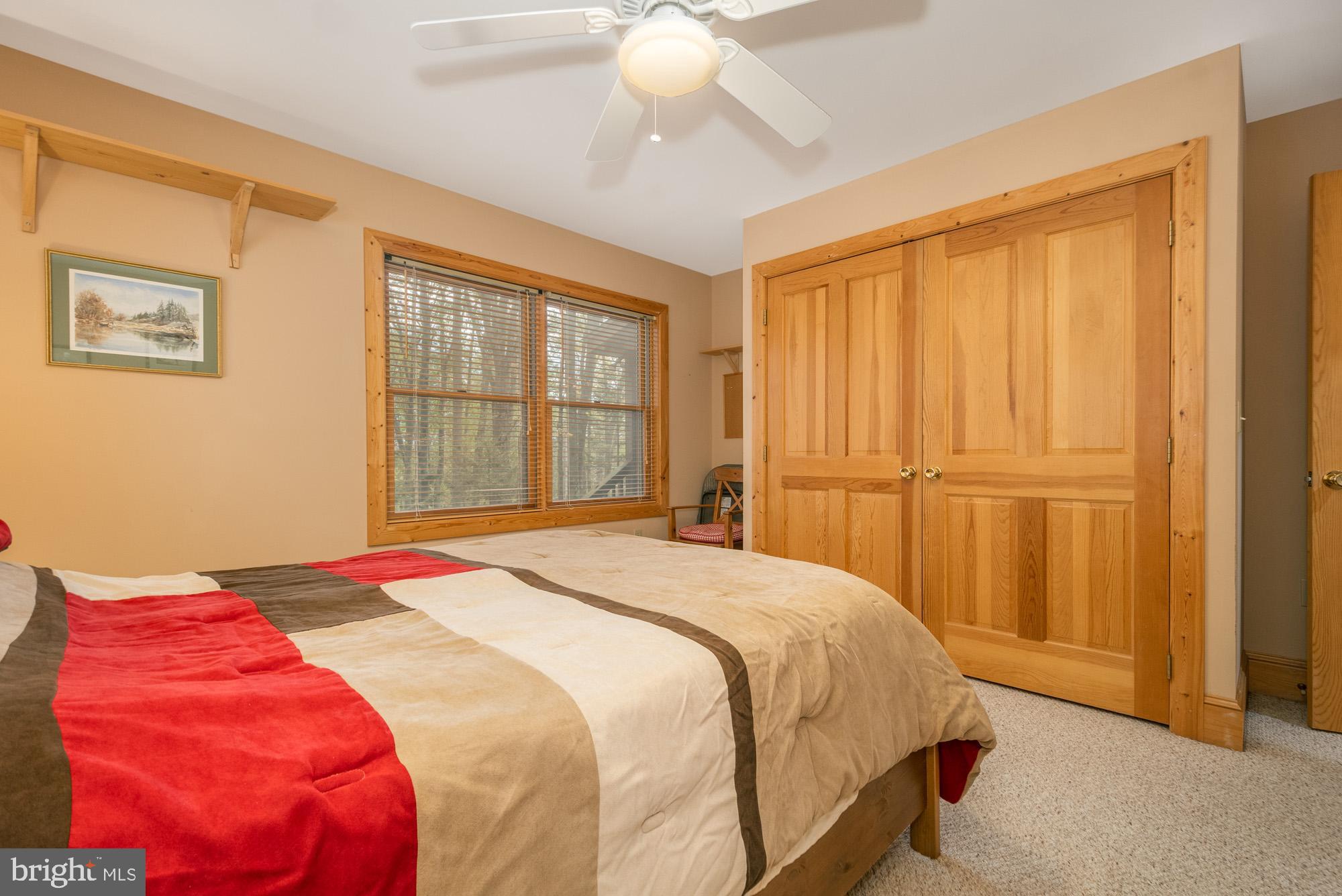 31 Linz Lane Swanton, MD 21561 - Photo 25 of 51 a bedroom with a bed and a window