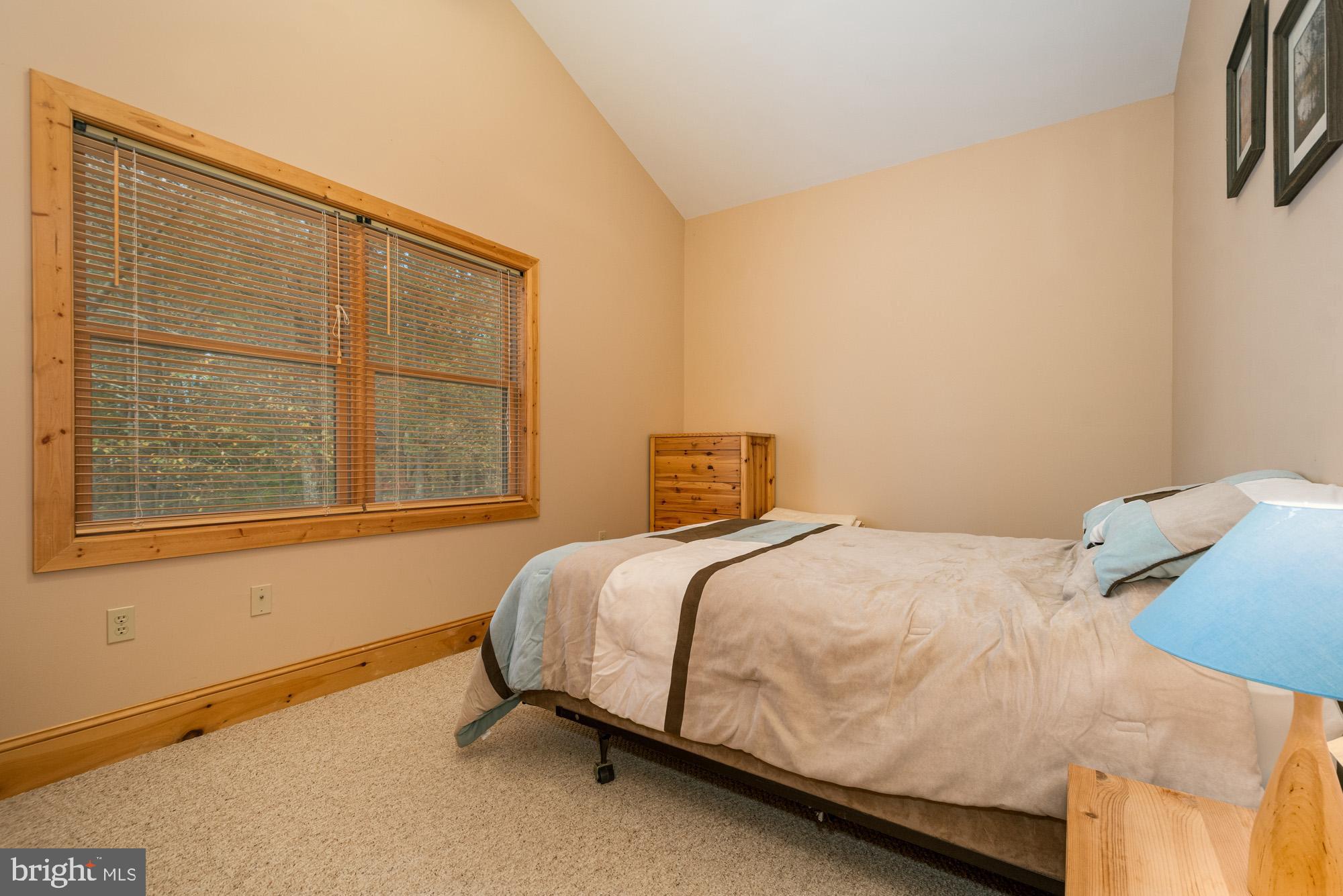 31 Linz Lane Swanton, MD 21561 - Photo 28 of 51 a bedroom with a bed and a window