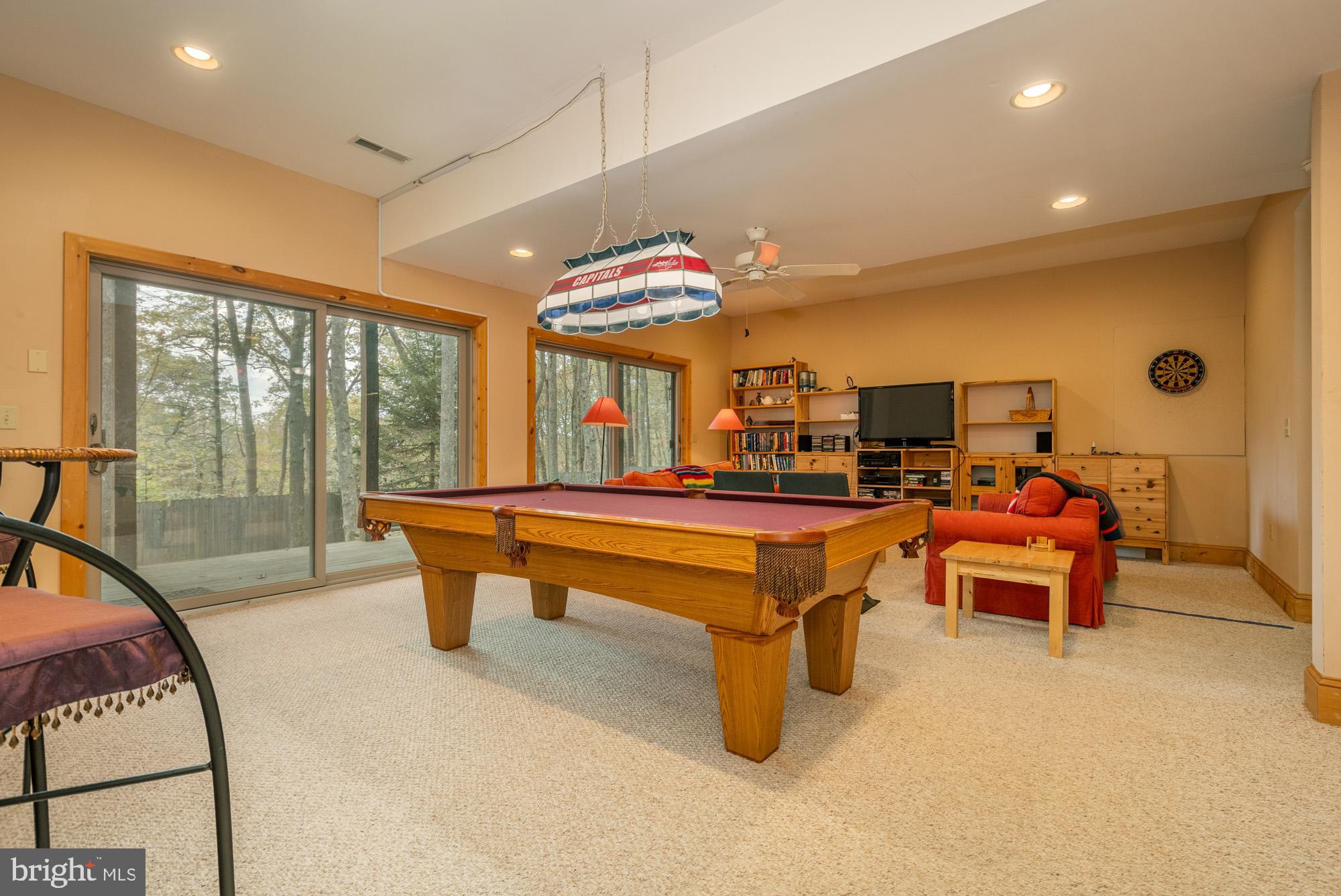 31 Linz Lane Swanton, MD 21561 - Photo 34 of 51 a living room with furniture a large window and a chandelier