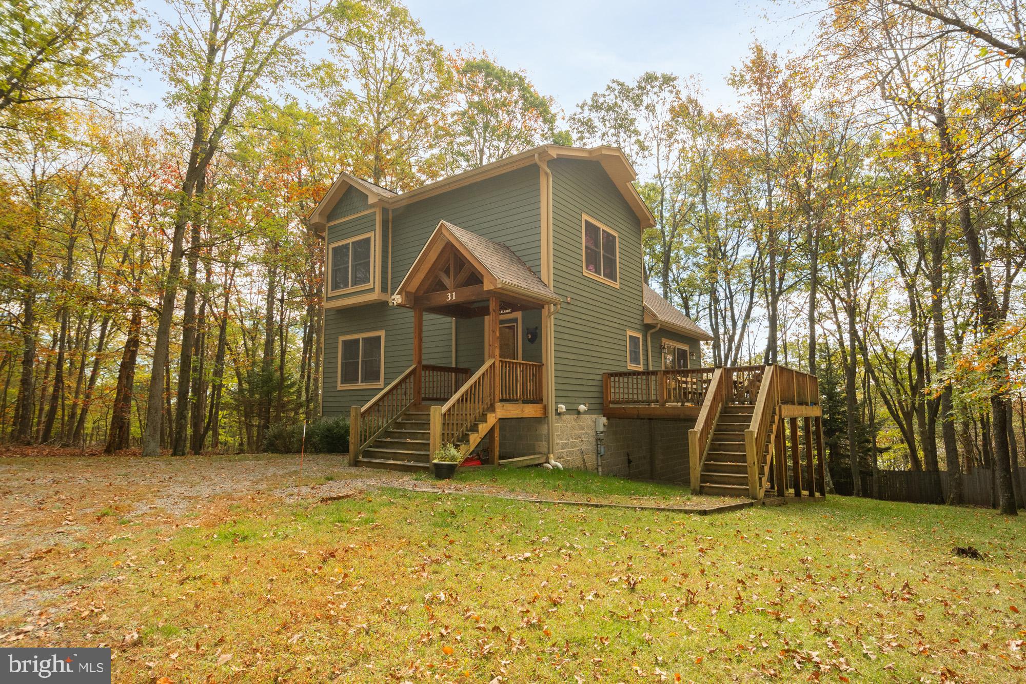 31 Linz Lane Swanton, MD 21561 - Photo 5 of 51 a house that has a tree in front of it
