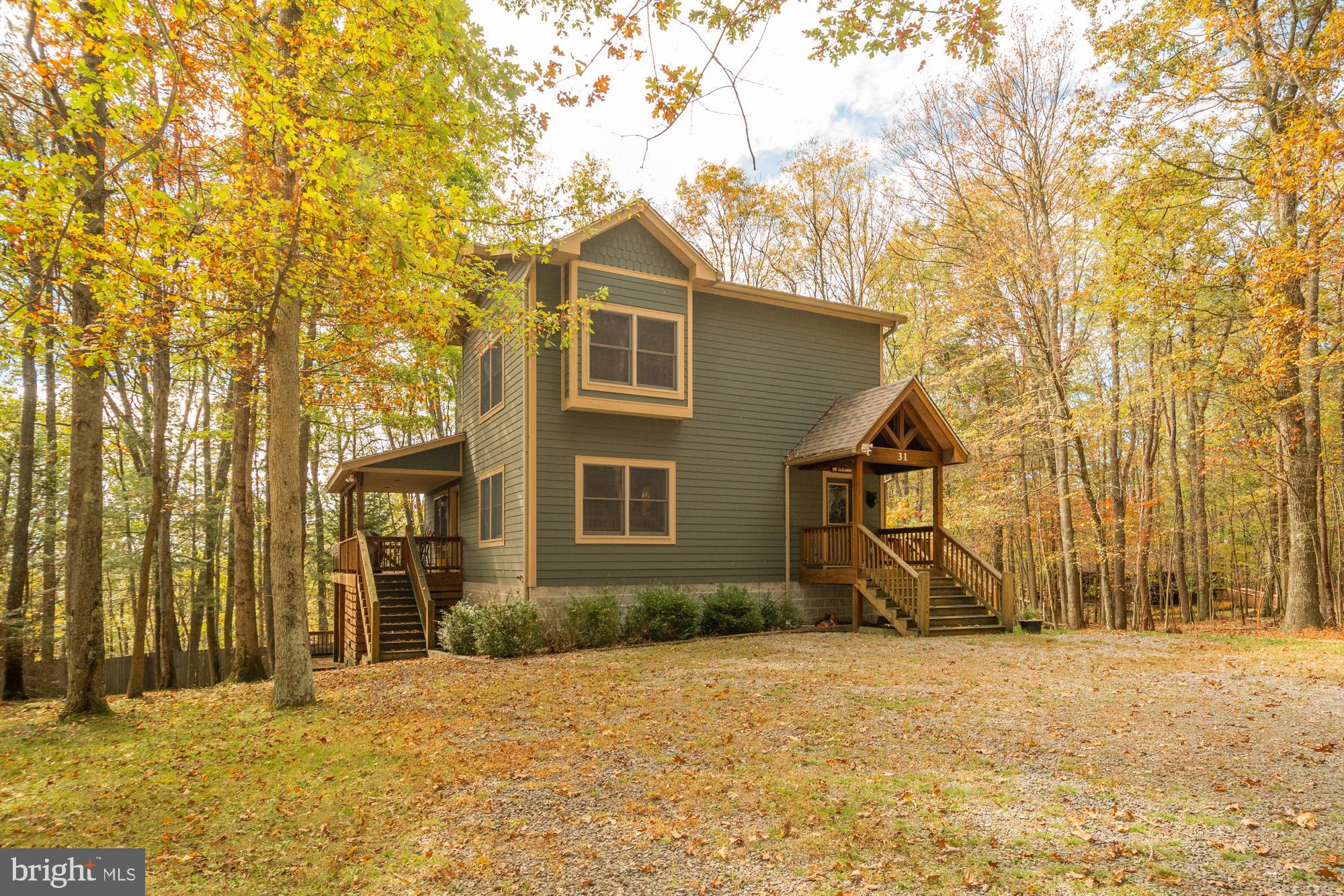 31 Linz Lane Swanton, MD 21561 - Photo 51 of 51 a view of a house with snow on the road