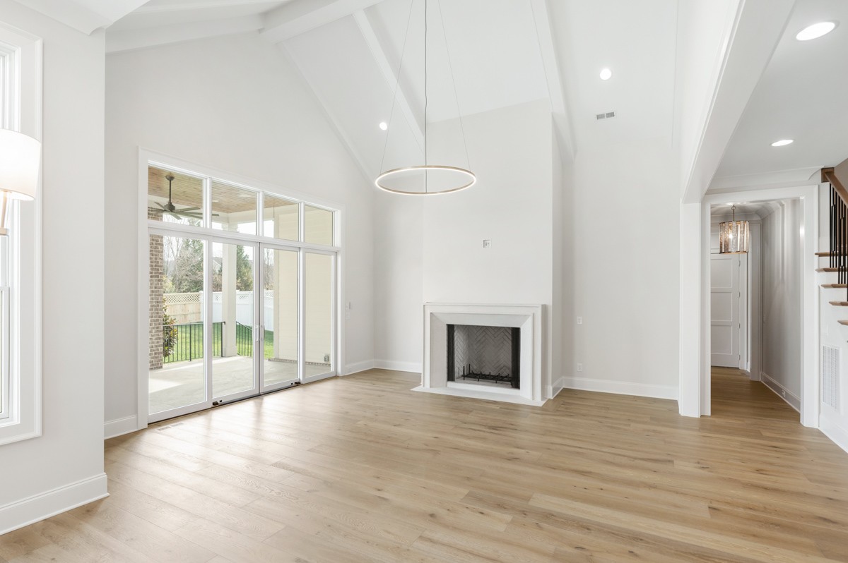 3151 Long Br Circle Franklin, TN 37064 - Photo 11 of 61 a view of an empty room with wooden floor and a window