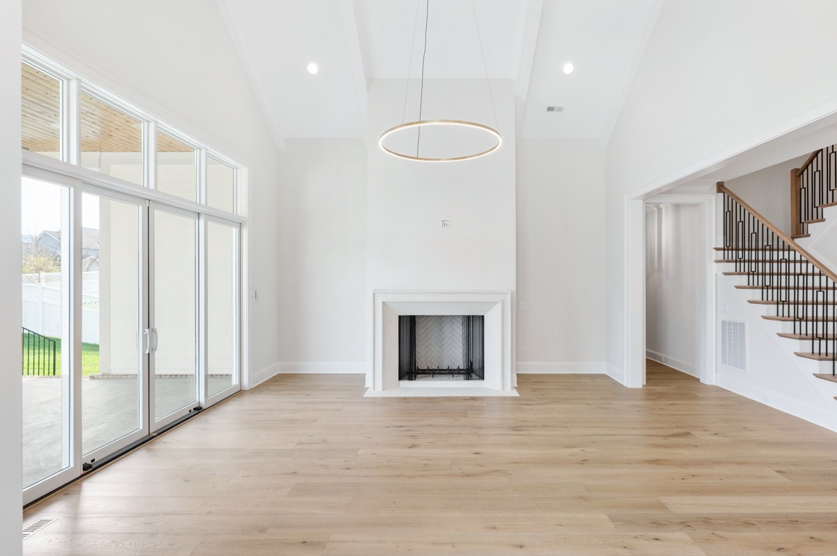 3151 Long Br Circle Franklin, TN 37064 - Photo 12 of 61 a view of an empty room with wooden floor and a window