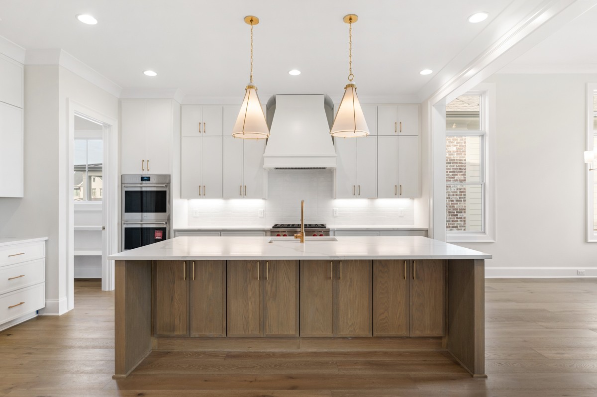 3151 Long Br Circle Franklin, TN 37064 - Photo 16 of 61 a view of dining table chairs wooden floor and kitchen view