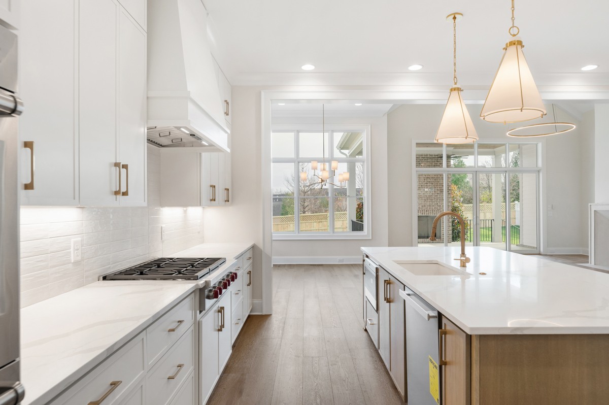 3151 Long Br Circle Franklin, TN 37064 - Photo 17 of 61 a kitchen with granite countertop a sink stove and cabinets