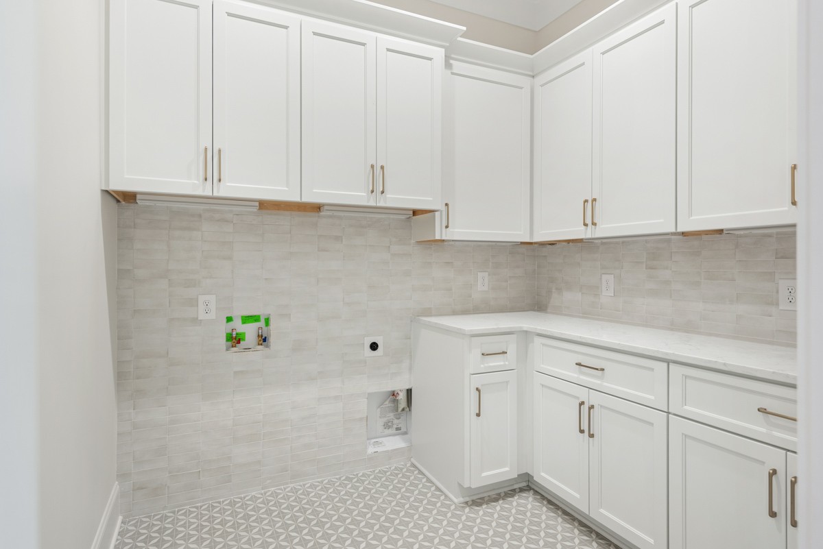 3151 Long Br Circle Franklin, TN 37064 - Photo 33 of 61 a kitchen with white cabinets and white appliances