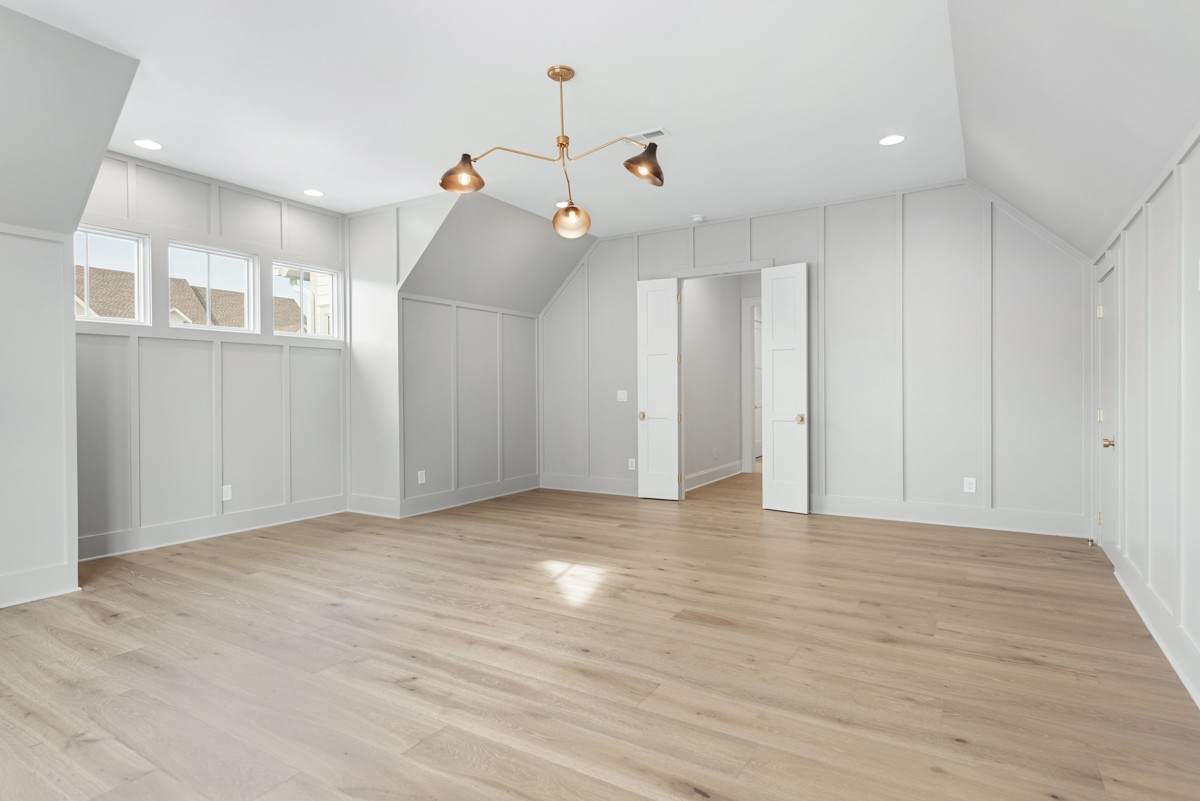 3151 Long Br Circle Franklin, TN 37064 - Photo 44 of 61 a view of an empty room with wooden floor and a ceiling fan