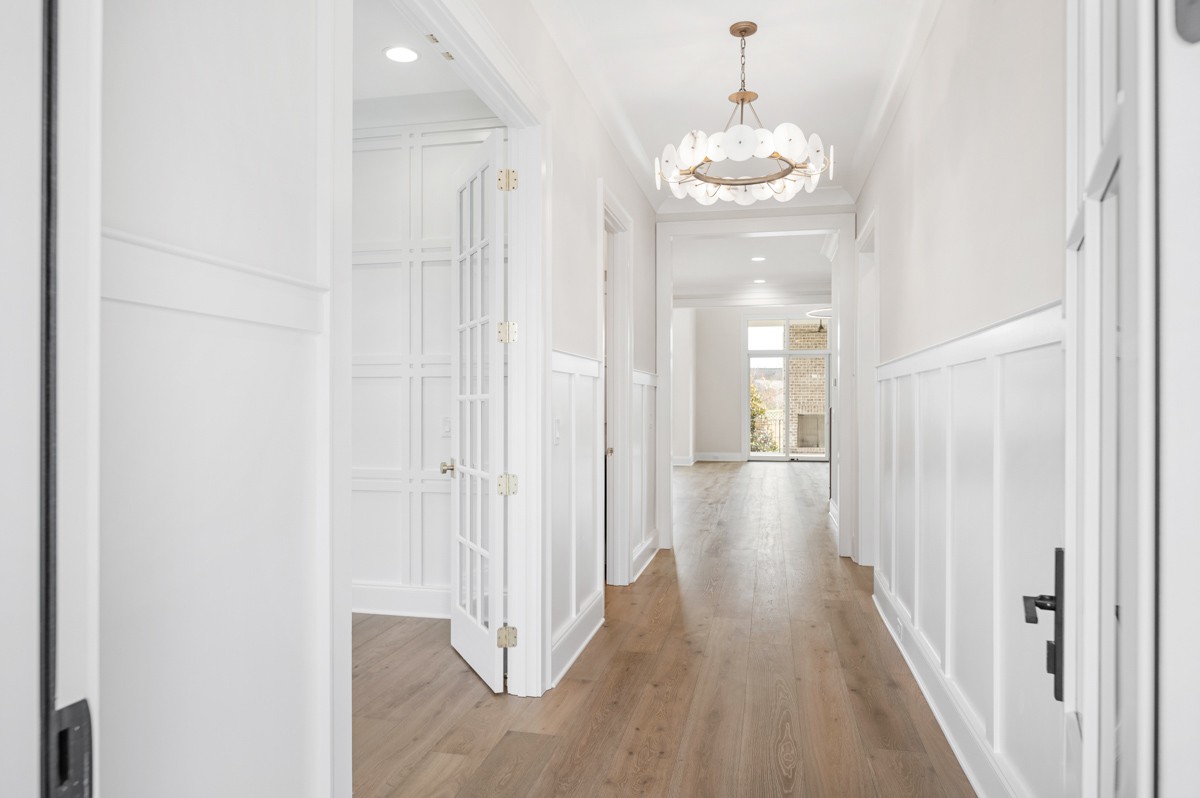 3151 Long Br Circle Franklin, TN 37064 - Photo 6 of 61 a view of a hallway with wooden floor and staircase