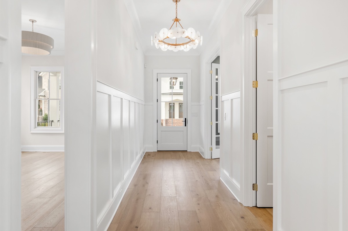 3151 Long Br Circle Franklin, TN 37064 - Photo 7 of 61 a view of a hallway with windows and chandelier