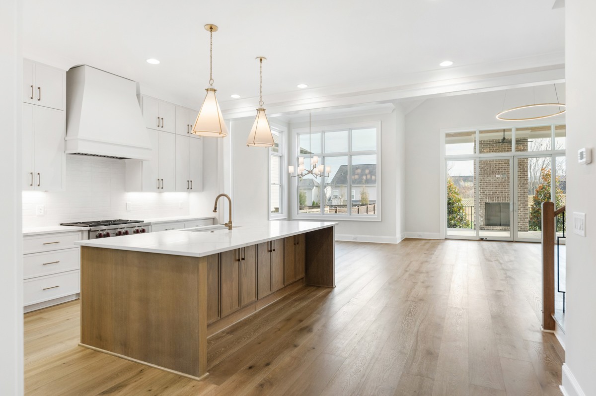 3151 Long Br Circle Franklin, TN 37064 - Photo 9 of 61 a large kitchen with kitchen island a large island a sink stainless steel appliances and cabinets