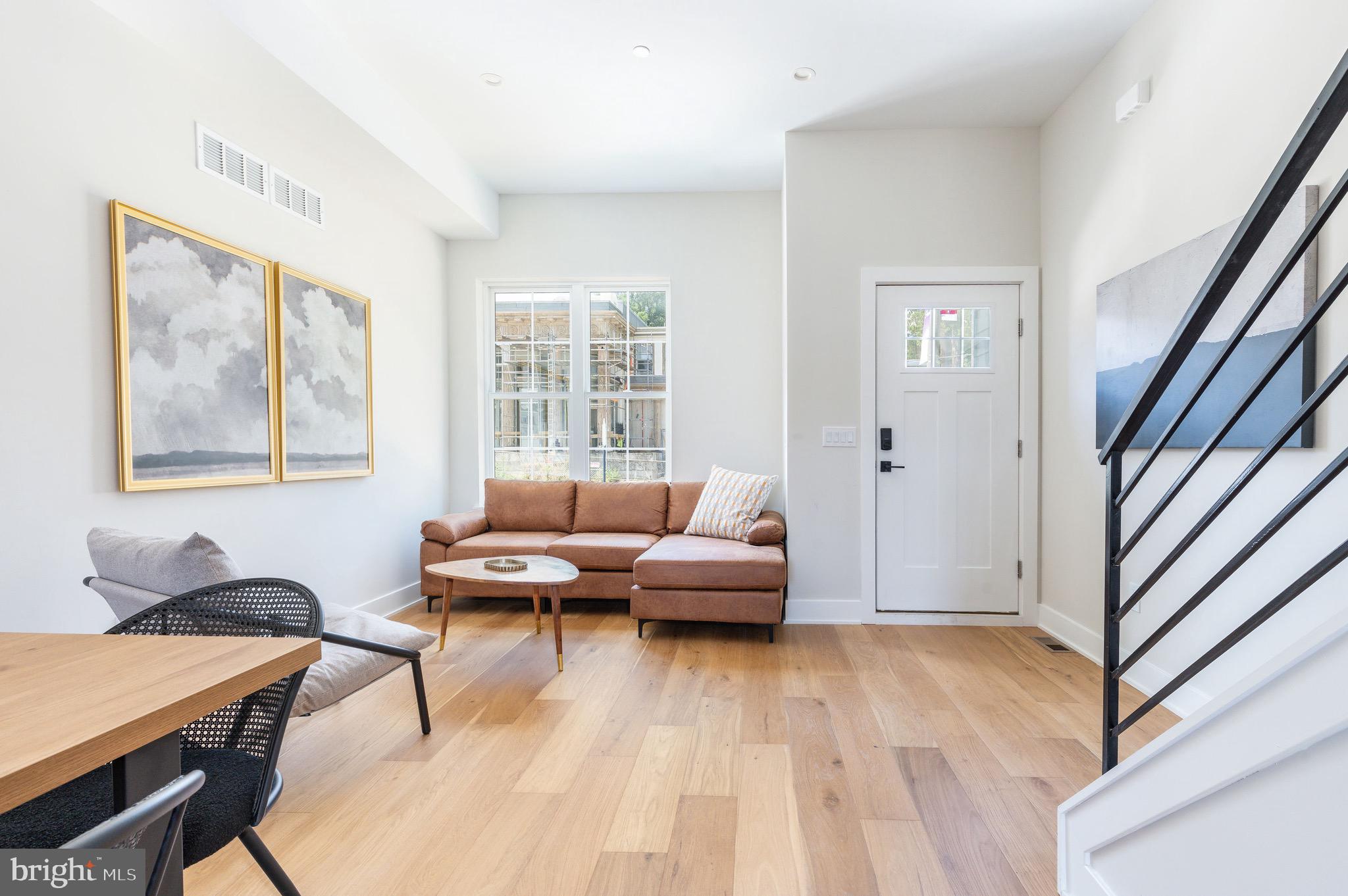 3841 Ridge Avenue Philadelphia, PA 19132 - Photo 12 of 45 a living room with furniture and a wooden floor