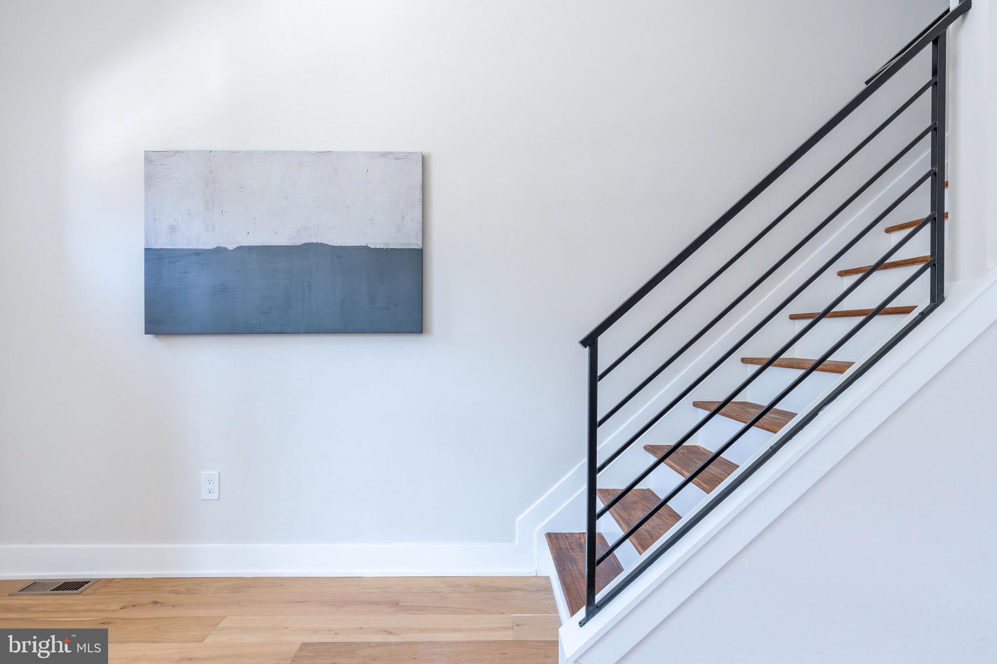 3841 Ridge Avenue Philadelphia, PA 19132 - Photo 13 of 45 a view of staircase with white walls and railing
