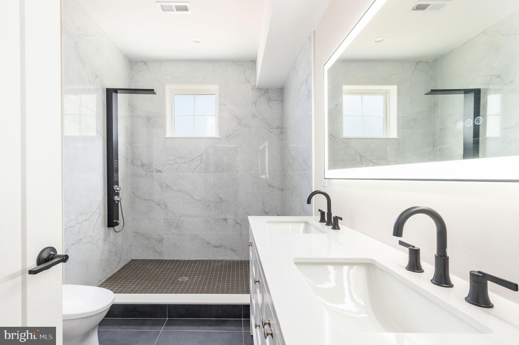 3841 Ridge Avenue Philadelphia, PA 19132 - Photo 18 of 45 a bathroom with a sink a toilet and shower