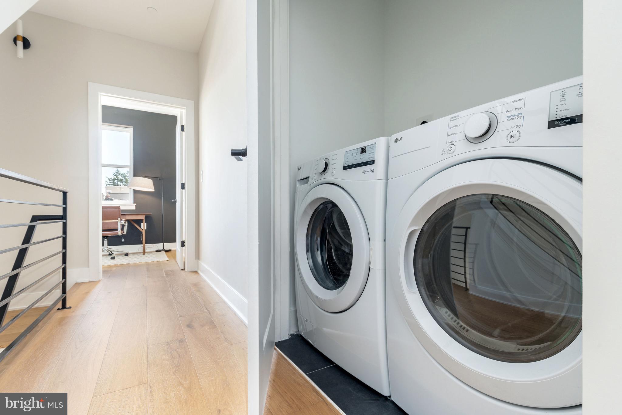 3841 Ridge Avenue Philadelphia, PA 19132 - Photo 21 of 45 a view of a hallway with washer and dryer