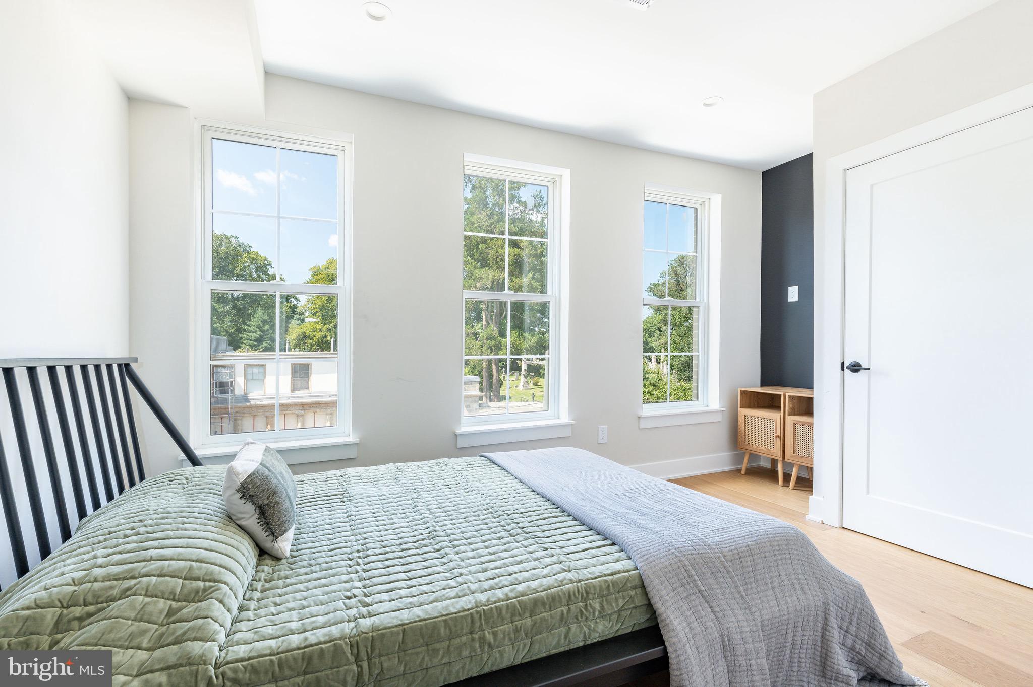 3841 Ridge Avenue Philadelphia, PA 19132 - Photo 26 of 45 a bedroom with a bed and a large window