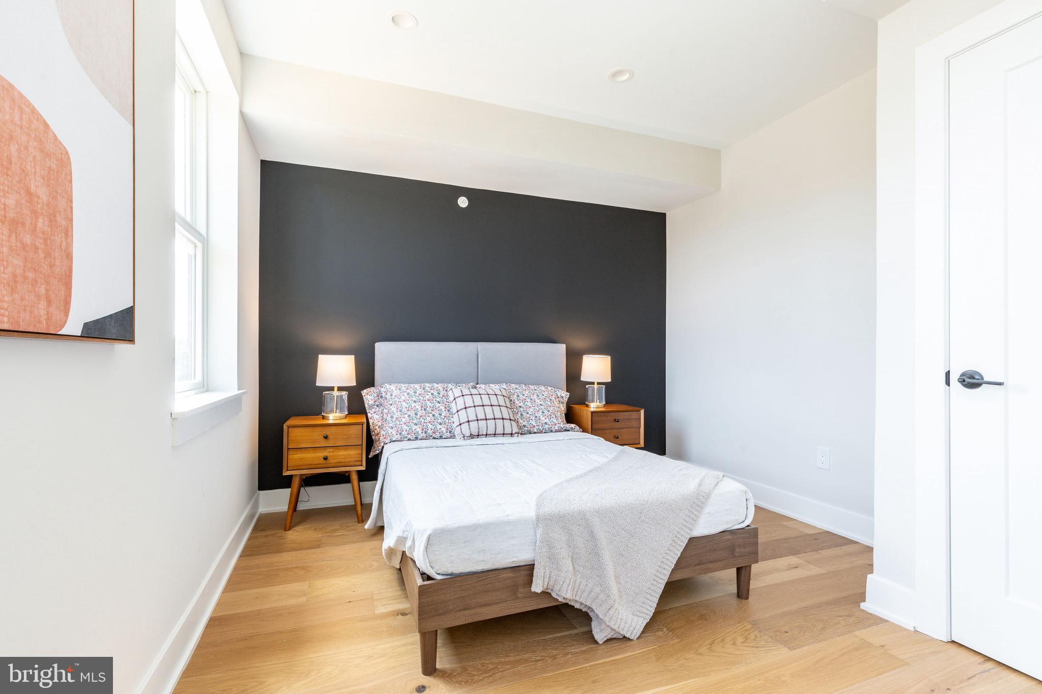 3841 Ridge Avenue Philadelphia, PA 19132 - Photo 28 of 45 a bedroom with a bed and lamp