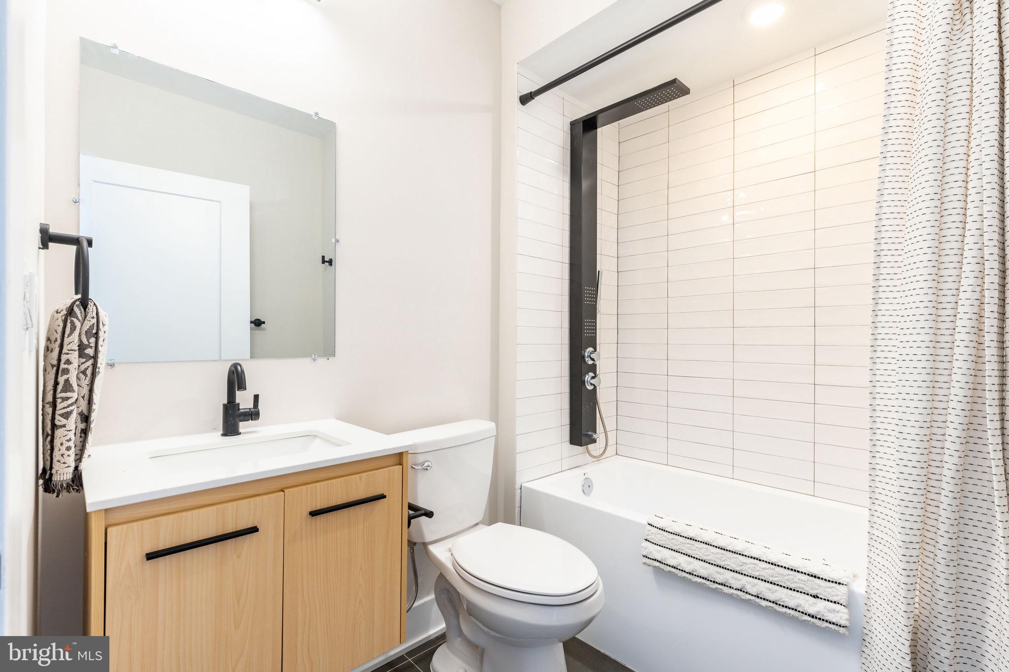 3841 Ridge Avenue Philadelphia, PA 19132 - Photo 30 of 45 a bathroom with a sink toilet and shower
