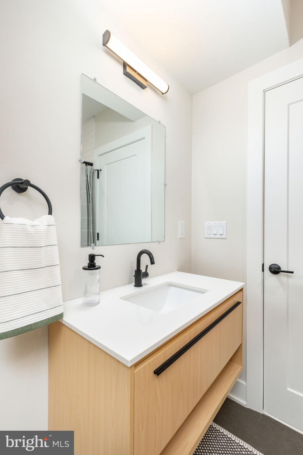 3841 Ridge Avenue Philadelphia, PA 19132 - Photo 32 of 45 a bathroom with a sink and a mirror
