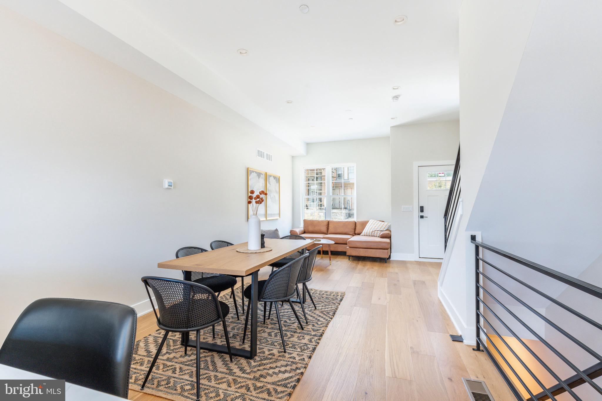 3841 Ridge Avenue Philadelphia, PA 19132 - Photo 6 of 45 a view of a dining room with furniture and a rug