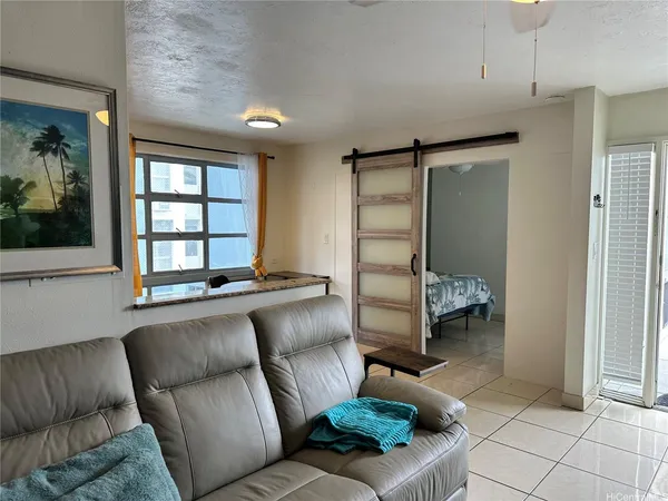 a living room with furniture and a window
