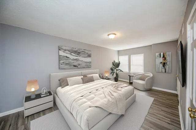 a bedroom with double bed and a window