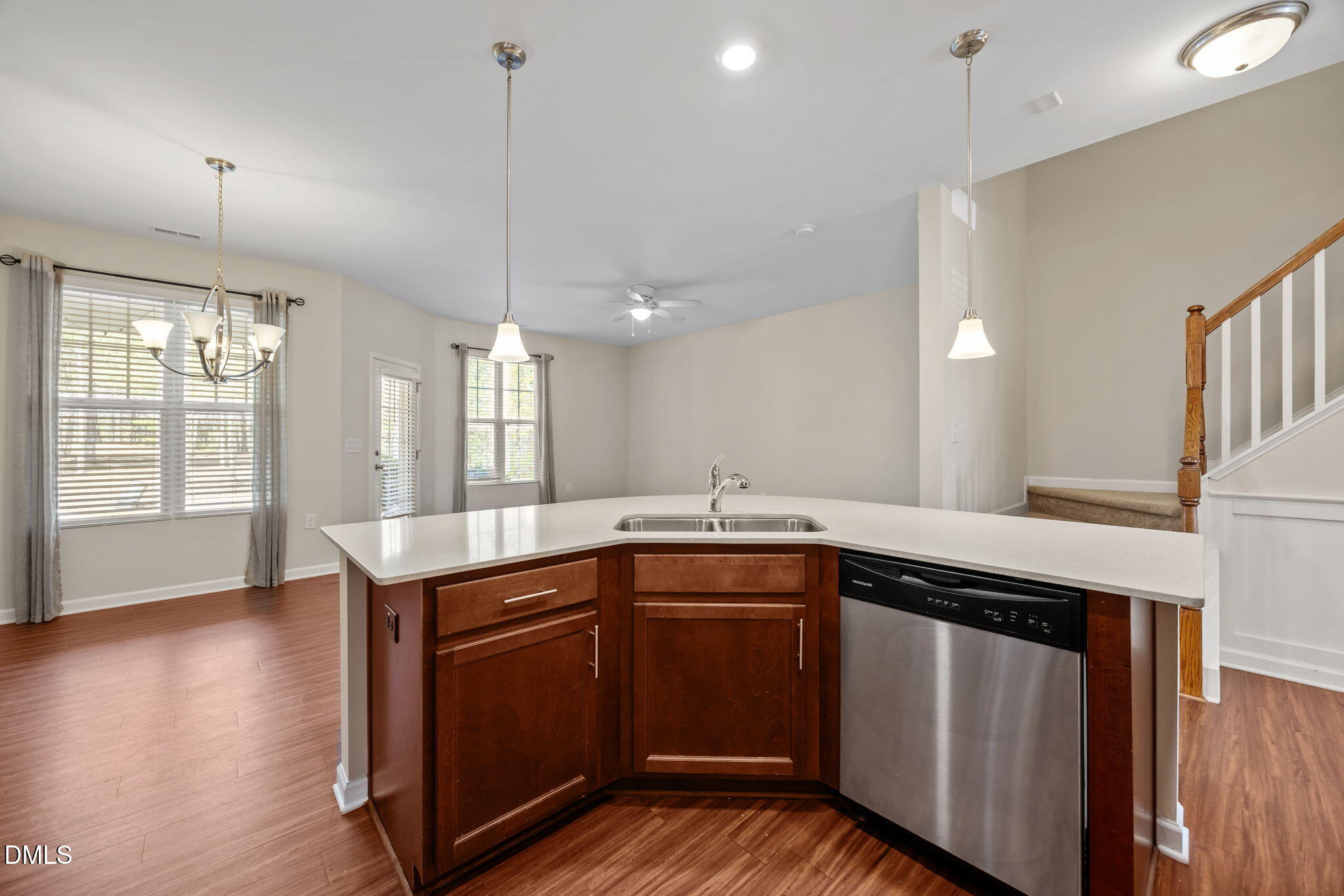 1005 Epiphany Road Morrisville, NC 27560 - Photo 7 of 23 a kitchen with sink cabinets and wooden floor