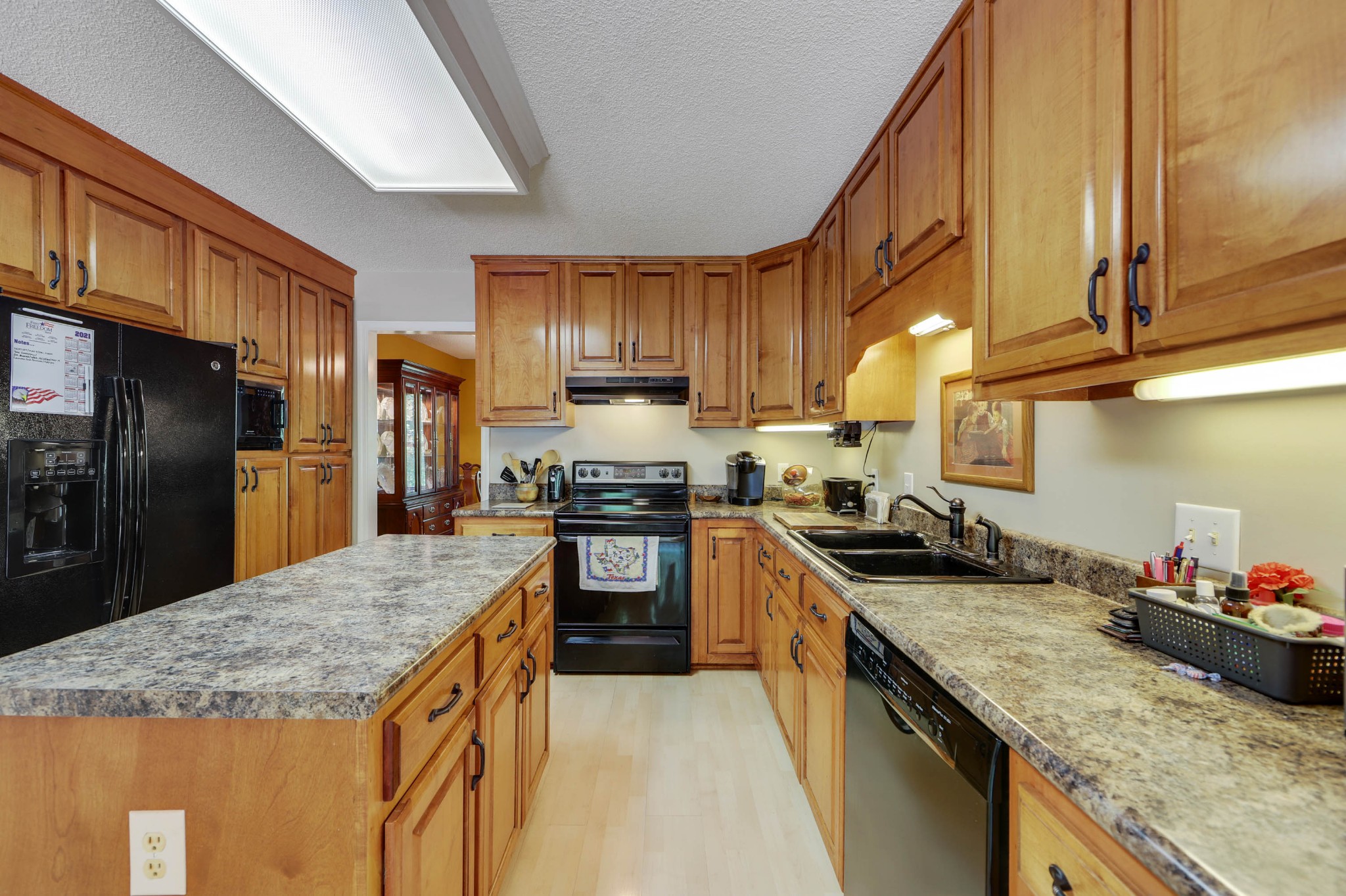 2721 Callis Road Lebanon, TN 37090 - Photo 14 of 38 a kitchen with granite countertop stainless steel appliances a sink a stove and cabinets